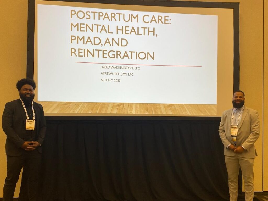 Two speakers presenting on postpartum care.